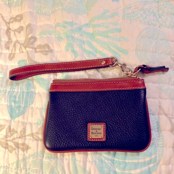 Dooney & Bourke Handbags - NWOT Dooney and Bourke medium wristlet in midnight blue.